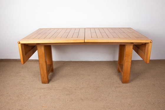 Image 1 of Gran mesa de comedor extensible de roble macizo, diseñada por Guillermo y Chambron en 1960.