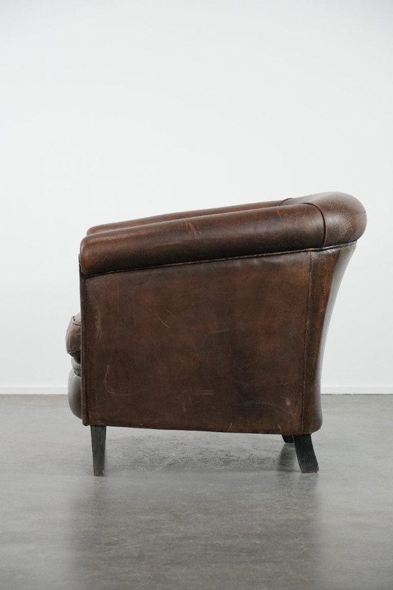 Image 1 of Sturdy and characterful vintage sheepskin club armchair