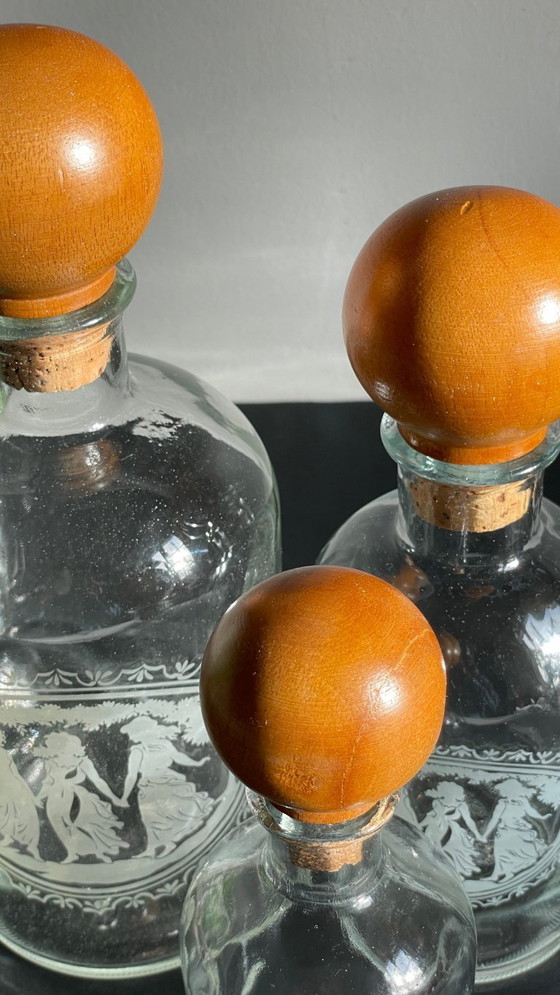 Image 1 of Vintage Engraved Glass and Wood Bottles