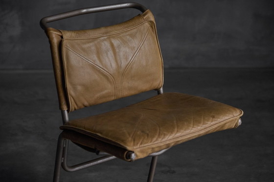 Image 1 of Eetkamerstoel van leer en staal, ontworpen door Raymond Rombouts, België, 20e eeuw.