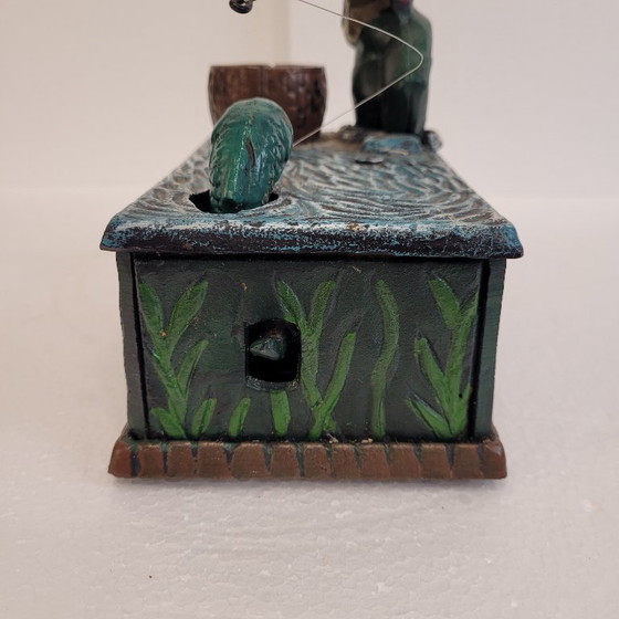Image 1 of "Fisherman" piggy bank with fishing mechanism, cast iron, 1950s - USA.