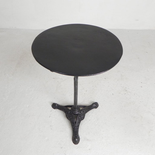 Bistro table with cast iron legs and round steel top, 1930s