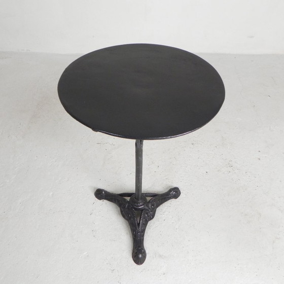 Image 1 of Bistro table with cast iron legs and round steel top, 1930s