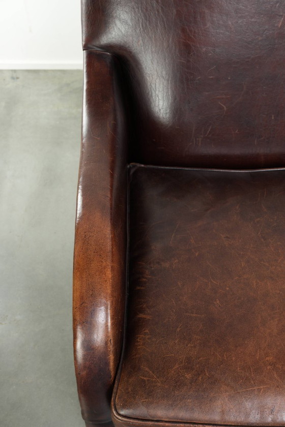 Image 1 of Poltrona di design in pelle di pecora in buone condizioni, con un bellissimo colore intenso e una seduta confortevole.