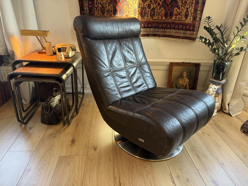 Dark brown vintage leather lounge armchair – timeless luxury and character