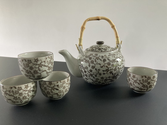 Image 1 of Gray ceramic tea set with brown floral pattern, four cups and a teapot