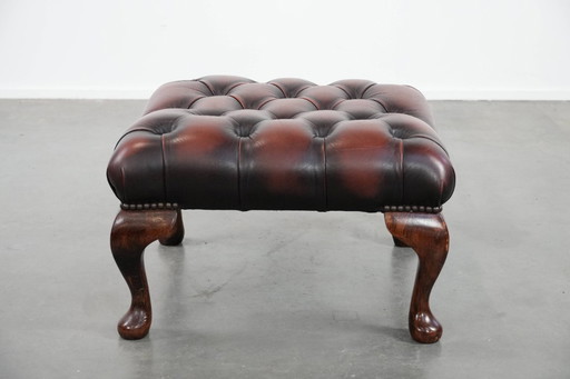 Dark brown Chesterfield footstool made of cowhide
