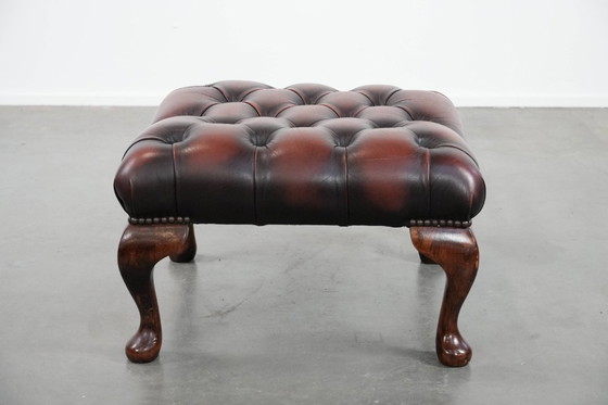 Image 1 of Dark brown Chesterfield footstool made of cowhide