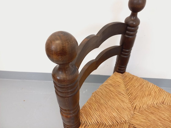 Image 1 of Vintage Charles Dudouyt Brutalist lage stoel in hout en stro uit de jaren 40
