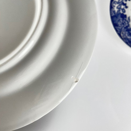 Image 1 of Set of 8 blue earthenware dinner plates with floral and bird decoration, early 20th century