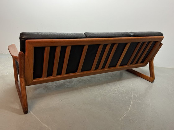 Image 1 of Mid-Century Design Komfort Solid Teak Wooden 3-Seat Sofa with Black Leather Cushions Attributed to Sven Ellekaer by Komfort