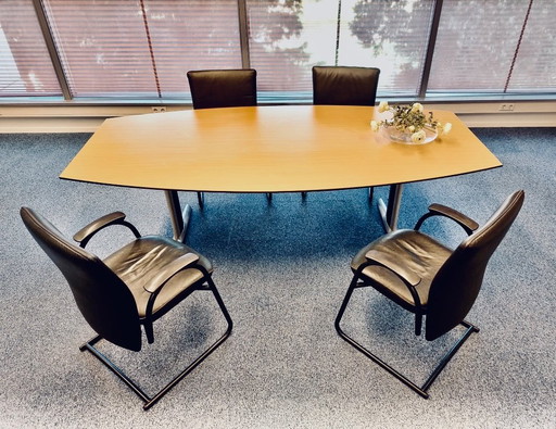 Beechwood dining table with 4 black leather chairs