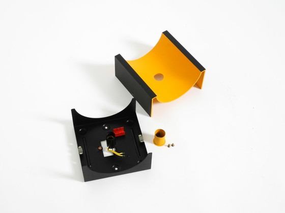 Image 1 of A rare pair of original 1960s Space Age metal wall lamps by Klaus Hempel for Kaiser Leuchten in yellow and black