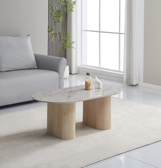 Image 1 of Tavolino ROXY – Piano in ceramica grigio Shakespeare e base in metallo effetto travertino