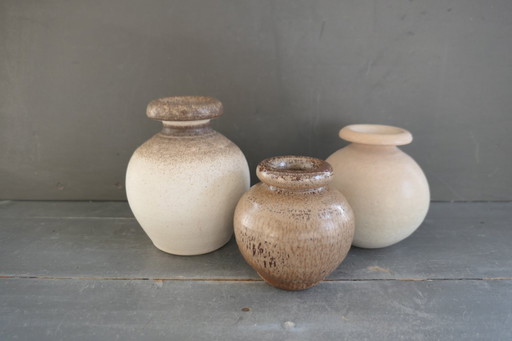 Vintage set of round vases in cream and brown tones