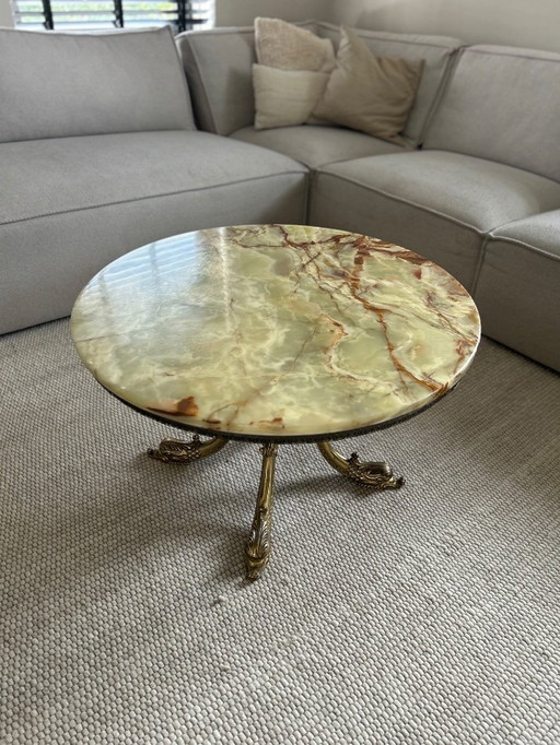 Vintage salontafel rond onyx marmer op messing voet