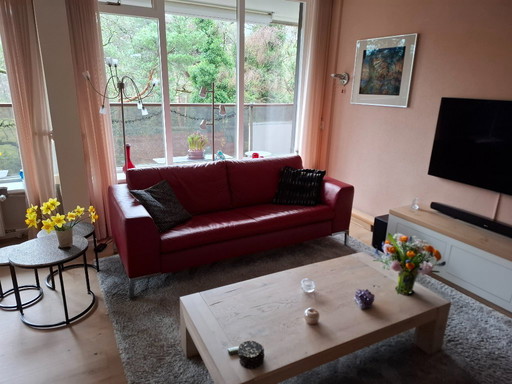 RED leather 2 1/2 seater sofa MONTEL SALE