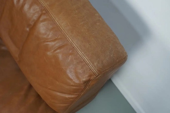 Image 1 of De Sede DS 76 loungestoel / slaapbank van cognackleurig leer, Zwitserland, jaren 1970