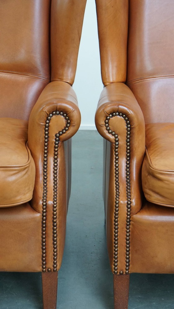 Image 1 of 2x Rundleren oorfauteuil afgewerkt met siernagels