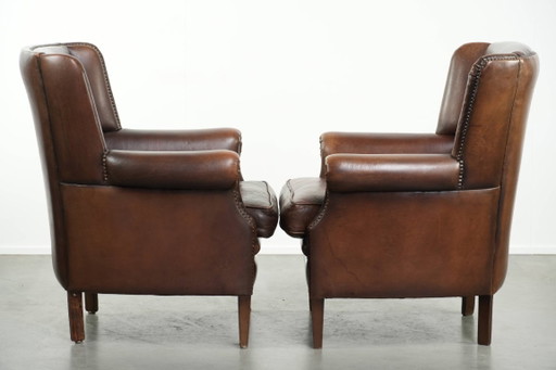 2x subtle English-style sheepskin wingback armchairs with beautiful colors