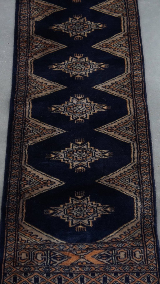 Tapis de style oriental dans les tons bleus 148x40cm