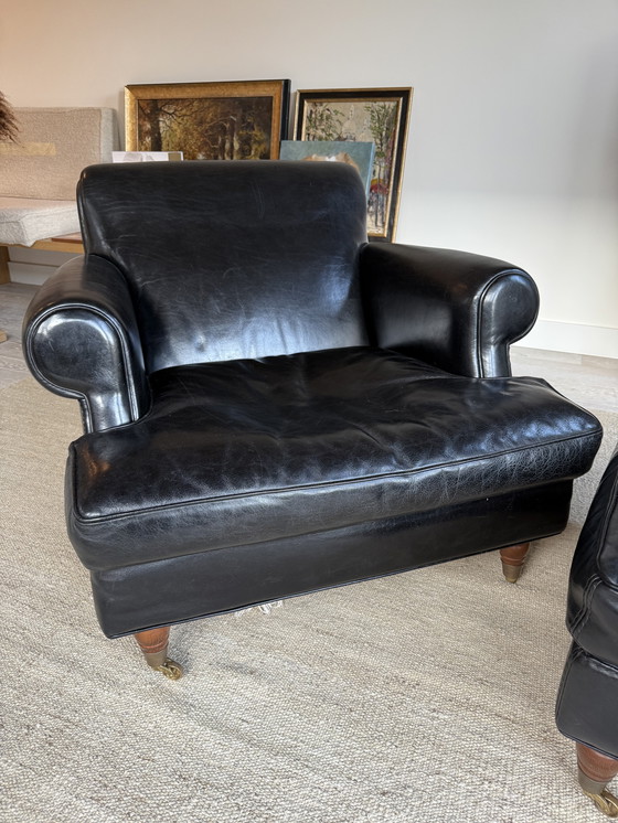 Image 1 of Baxter fauteuil + hocker, model Charlotte Longe (zwart leer)