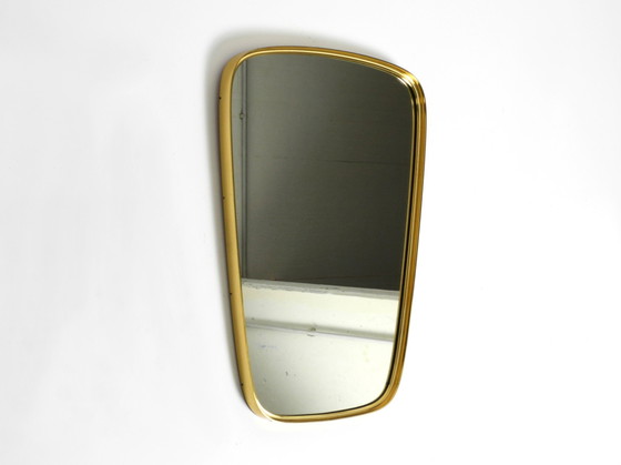 Image 1 of Magnifique miroir mural original du Mid Century Modern "Münchener Zierspiegel" avec cadre en laiton lourd