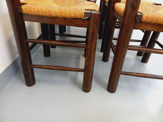 Image 1 of Set van 6 vintage brutalistische stoelen van Georges Robert, gemaakt van hout en stro, uit de jaren 50 en 60.