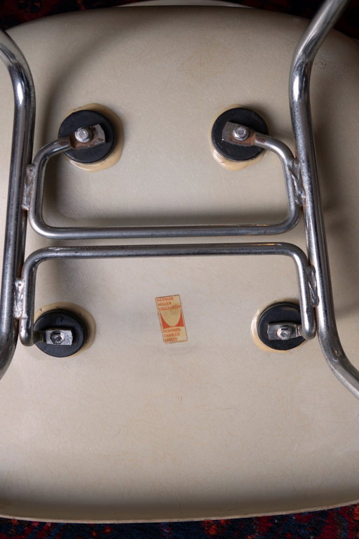 Three vintage white bucket chairs by Charles & Ray Eames for Herman Miller