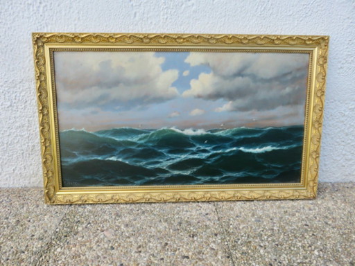 Framed painting depicting a very rough ocean 45cm x 76cm