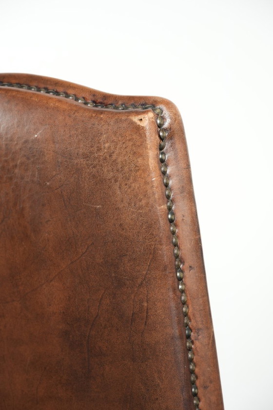 Image 1 of 4 x Vintage eetkamerstoel gemaakt van schapenleer met een hoge rug