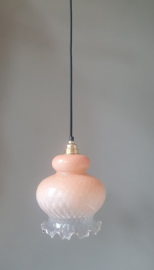 vintage glass floral pendant lamp in pink pastel color with texture. Partly transparent.