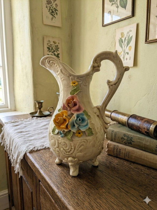 Ceramic pitcher with floral decor