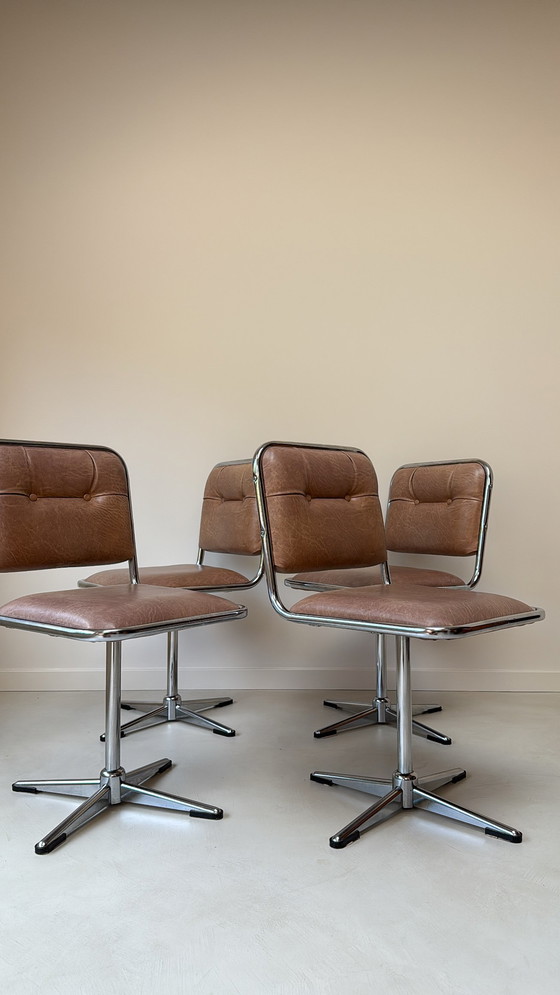 Image 1 of Four vintage chrome swivel chairs with faux leather