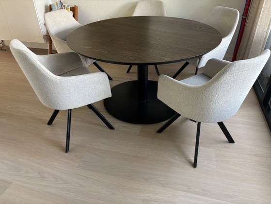 Image 1 of Solid oak dining table with steel column base.