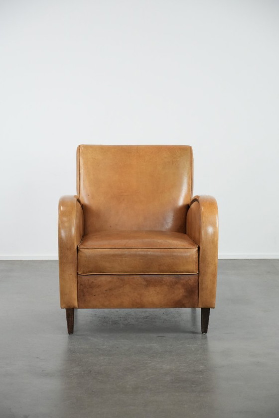 Image 1 of Luxurious armchair made of cowhide leather with a beautiful warm color scheme