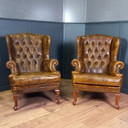 un set di due poltrone Chesterfield vintage color cognac