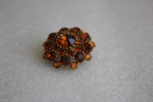 Vintage costume jewelry brooch with amber rhinestones, marked SPHINX