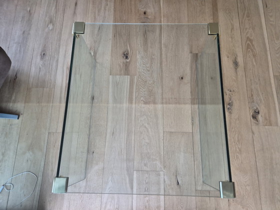 Glass coffee table with brass-colored details. – Side tables (photo 2 of 5)