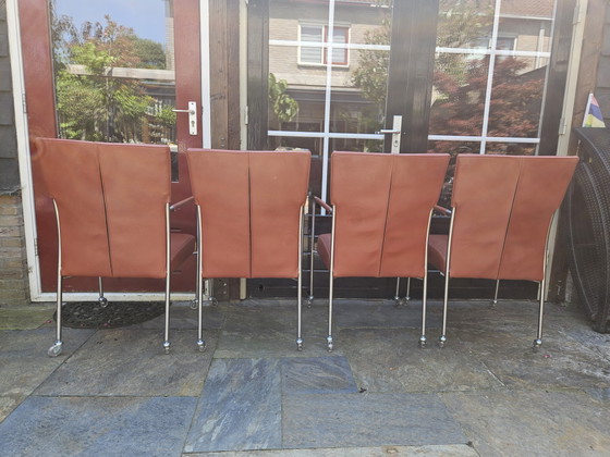 Image 1 of 4 red leather dining chairs on wheels, brand Bert Plantagie