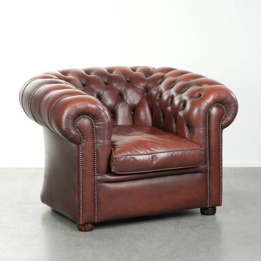 Beautiful red/brown cowhide Chesterfield armchair in a classic English style