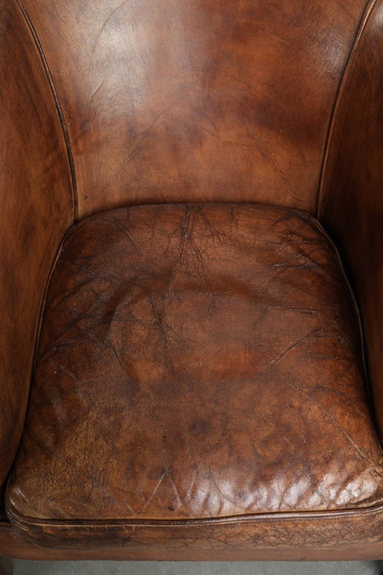 Image 1 of 2 fauteuils club vintage en peau de mouton, au look superbe et à l'assise confortable.