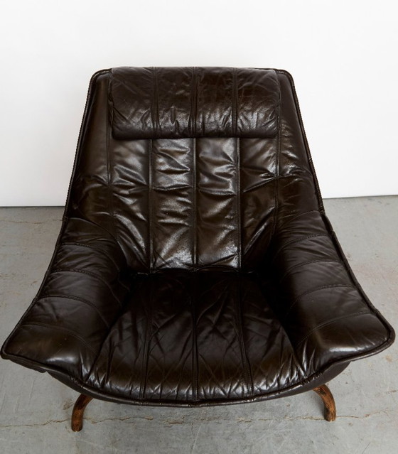 Image 1 of Fauteuil en voetenbank van bamboe en leer