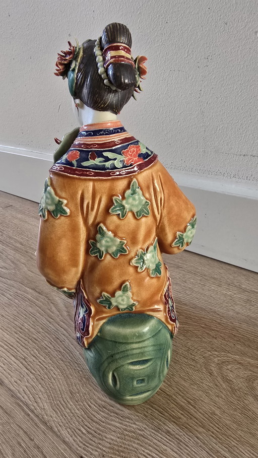 Chinese Shiwan ceramic sitting lady