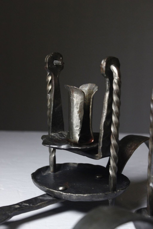 Pair of wrought iron castle-style wall sconces with candles, mid-20th century