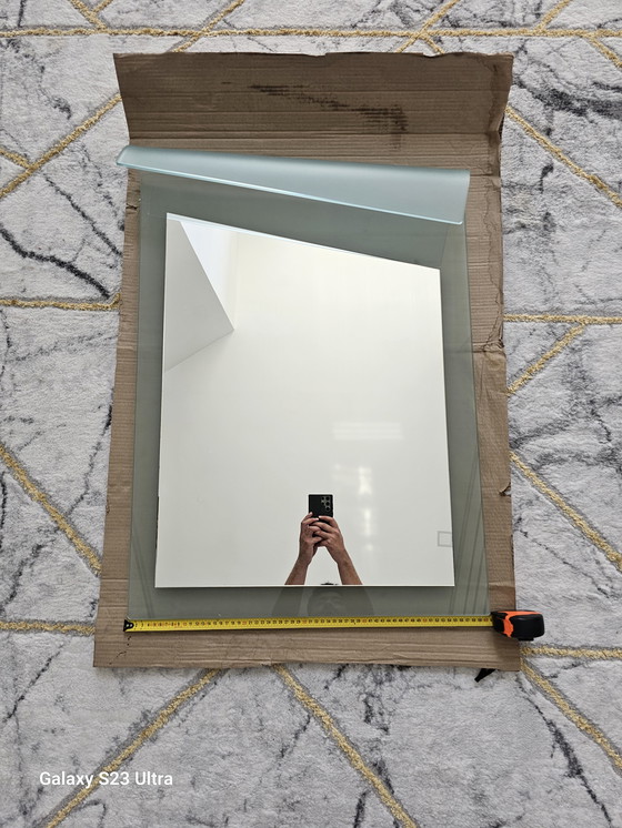 Image 1 of 80's mirror in perfect condition with curved design