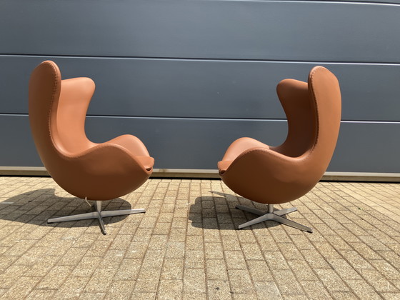 Image 1 of 2x Fritz Hansen Egg Chair + Ottoman en cuir Cognac NEUF !!!