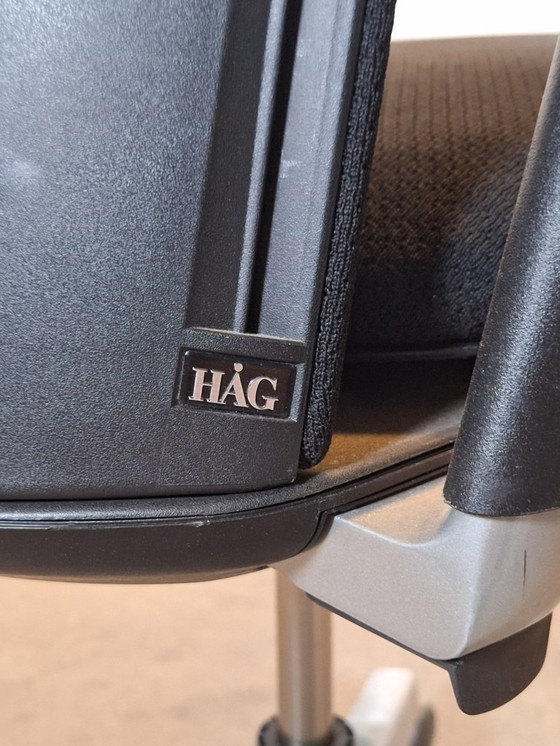 Image 1 of HAG Futu Verstelbare zwarte bureaustoelen op wielen met kleine beschadiging aan de armleuning