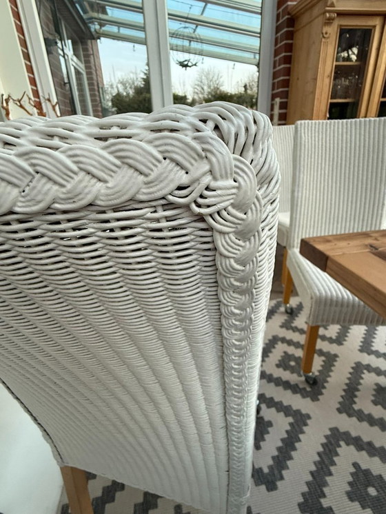 Image 1 of 8 originele Lloyd LOOM stoelen, eetkamerstoelen, ook in kleinere aantallen verkrijgbaar, houten frame, wit riet.