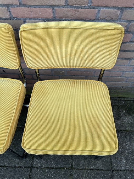 6 sillas de tela acanalada amarilla con estructura tubular cromada